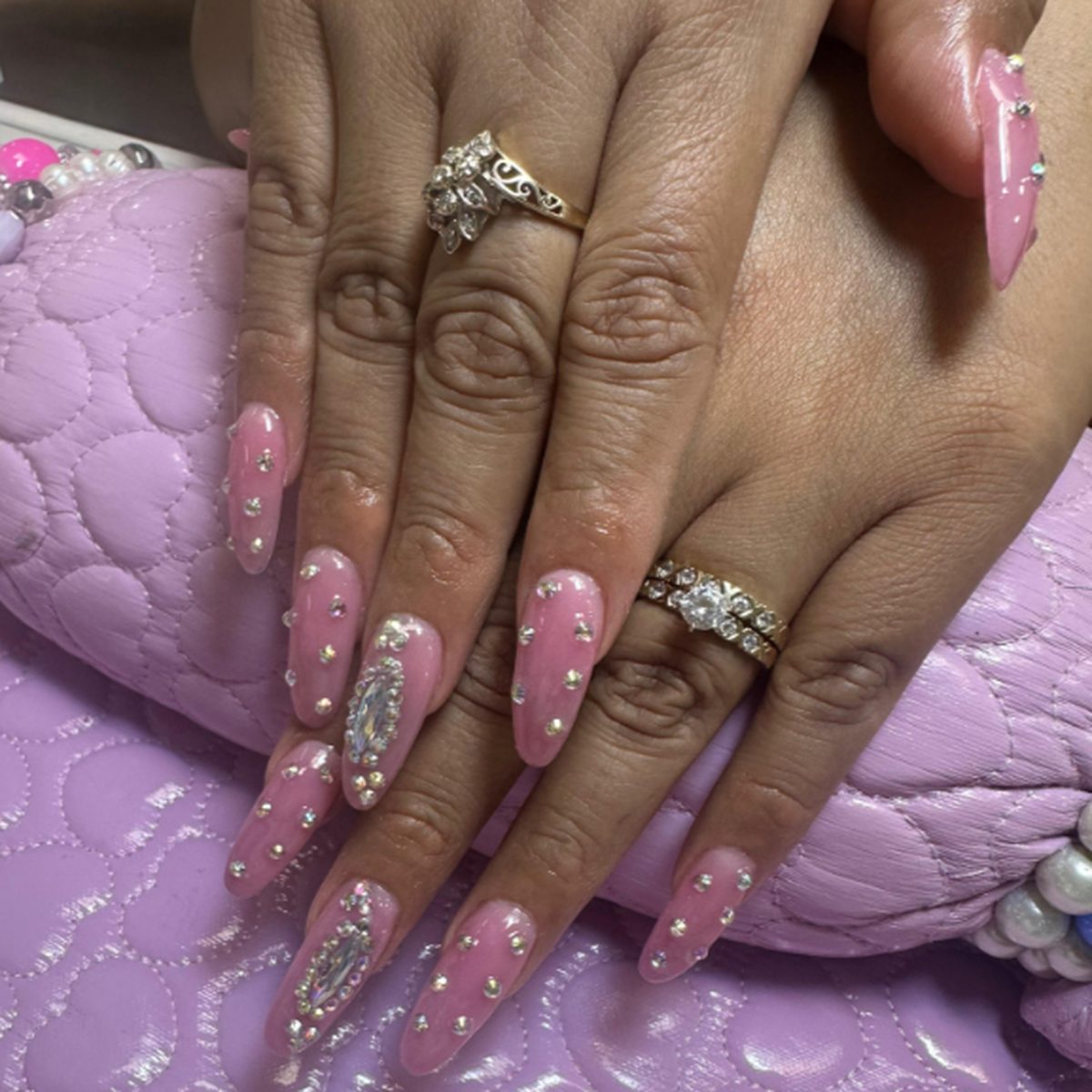 Pink gel nails with rhinestone detail